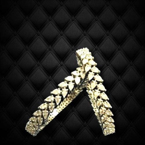 Gleaming drop criss cross bangle